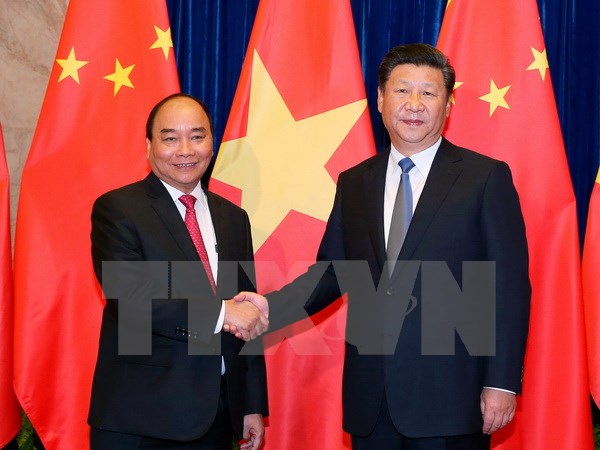 Thủ tướng Nguyễn Xuân Phúc hội kiến Tổng Bí thư, Chủ tịch nước Trung Quốc Tập Cận Bình. (Ảnh: Thống Nhất/TTXVN)