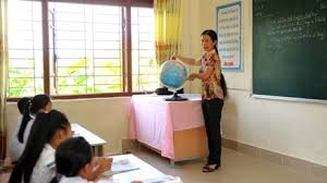 Nguyen Thi Hoi teaches a geography lesson to students at the remote island Ban Son Primary School. 