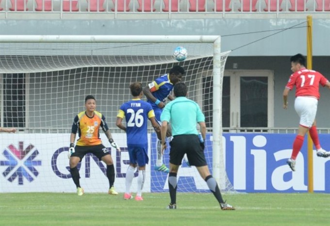 Quang Ninh Coal’s striker Mac Hong Quan (right) heads a ball during the match between Quang Ninh Coal and Yadanarbon in AFC Cup group round match. — Photo the-afc.com