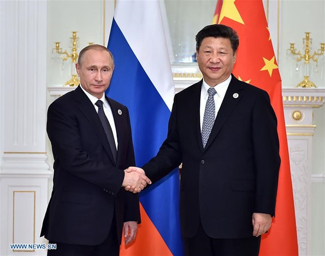 Chủ tịch Trung Quốc Tập Cận Bình (phải) và Tổng thống Nga Vladimir Putin trong một cuộc gặp. (Nguồn: Xinhuanet)