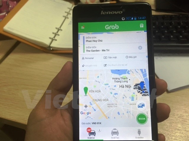 Ứng dụng phần mềm gọi xe của Grab. (Ảnh: Việt Hùng/Vietnam+)