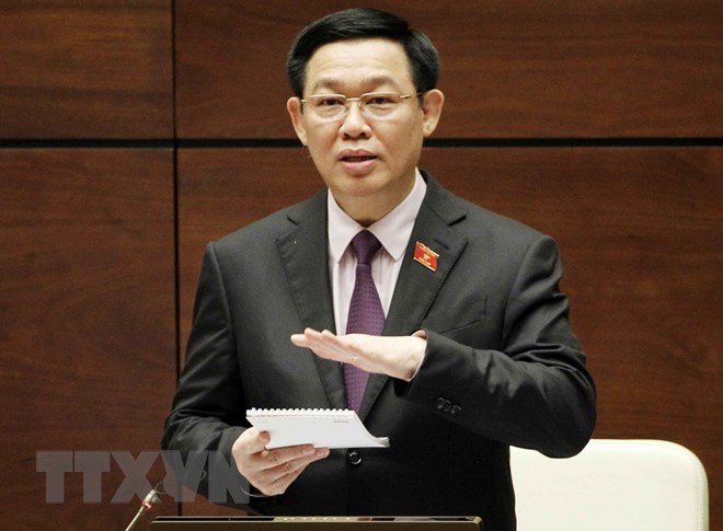 Phó Thủ tướng Vương Đình Huệ trả lời chất vấn của Đại biểu Quốc hội. (Ảnh: Văn Điệp/TTXVN)