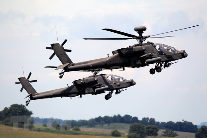 Trực thăng quân sự Apache của Mỹ tham gia một cuộc diễn tập tại Romania ngày 15/7. (Nguồn: THX/TTXVN)