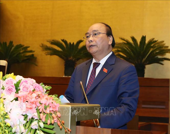 Thủ tướng Chính phủ Nguyễn Xuân Phúc trình bày Báo cáo về tình hình kinh tế - xã hội năm 2018 và kế hoạch phát triển kinh tế - xã hội năm 2019. Ảnh: Thống Nhất/TTXVN