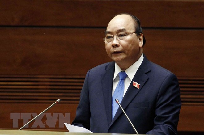 Thủ tướng Chính phủ Nguyễn Xuân Phúc trả lời chất vấn của đại biểu Quốc hội. (Ảnh: Văn Điệp/TTXVN)