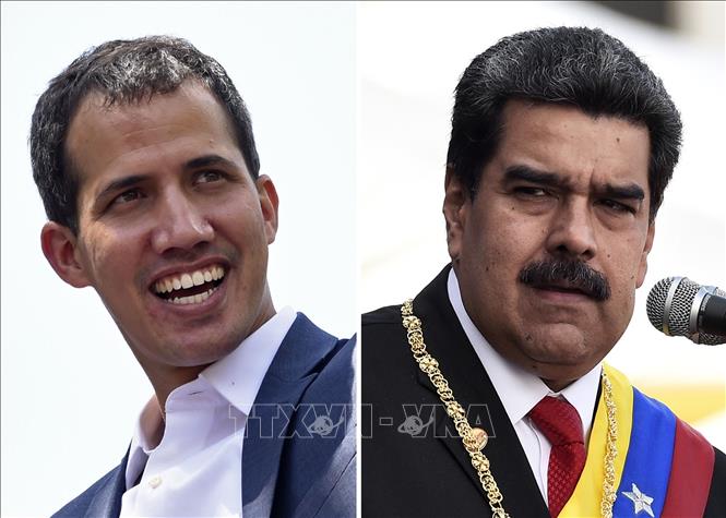  Tổng thống Venezuela Nicolas Maduro (phải) và lãnh đạo đối lập Juan Guaido. Ảnh: AFP/TTXVN