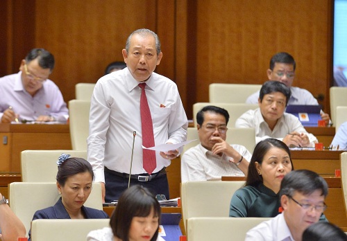 Phó Thủ tướng Thường trực Chính phủ Trương Hòa Bình trả lời chất vấn tại Quốc hội - Ảnh: VGP/Nhật Bắc