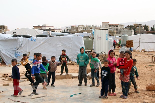 Người di cư Syria tại một trại tị nạn ở thung lũng Bekaa, Liban. (Ảnh: AFP/TTXVN)