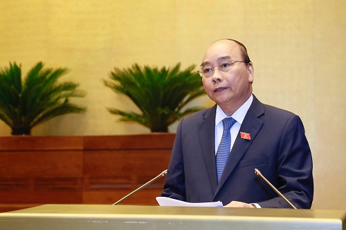Thủ tướng Nguyễn Xuân Phúc trả lời chất vấn trước Quốc hội - Ảnh: VGP/Nhật Bắc