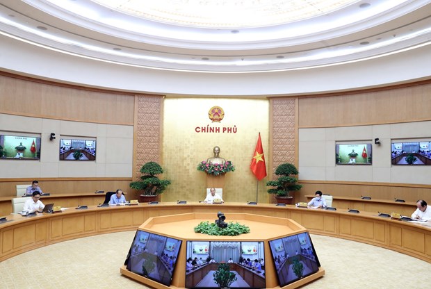 Tron 90 ngay danh Thủ tướng Nguyễn Xuân Phúc chủ trì buổi làm việc Thường trực Chính phủ với Ban Chỉ đạo Quốc gia phòng, chống dịch COVID-19. (Ảnh: Thống Nhất/TTXVN)