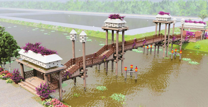 Công trình cầu Kiều với chất liệu chủ yếu là gỗ bắc qua kênh tại cổng vào chính của khuôn viên rừng tràm.