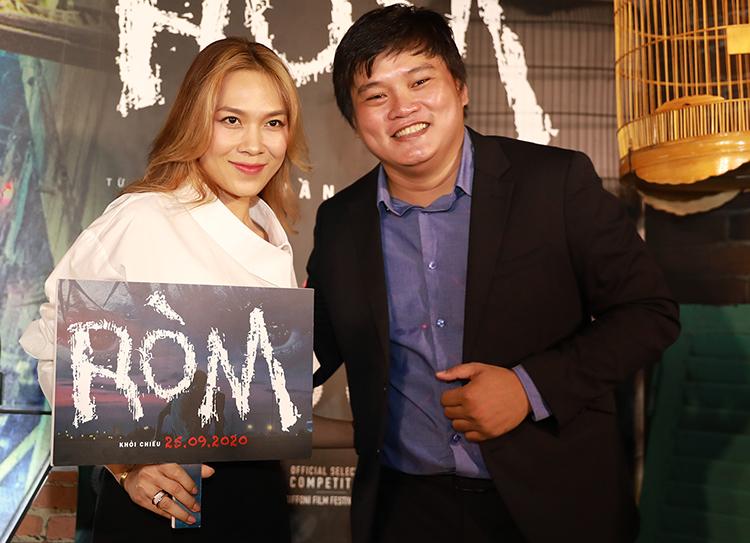 Đạo diễn Trần Thanh Huy bên ca sĩ Mỹ Tâm - khách mời tại sự kiện công chiếu phim 