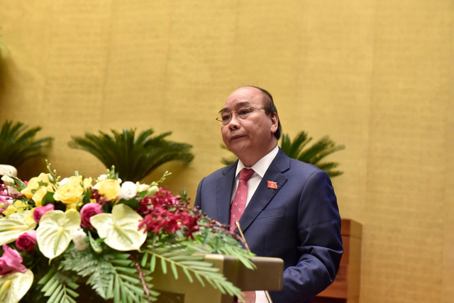Thủ tướng Chính phủ Nguyễn Xuân Phúc báo cáo tình hình thực hiện kế hoạch phát triển kinh tế - xã hội năm 2020 và 5 năm 2016 - 2020, nhiệm vụ 5 năm tới từ 2021 - 2025. (Ảnh: VGP)
