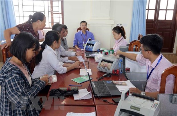 Một buổi giao dịch cho vay tại điểm giao dịch xã Thanh Nguyên, huyện Thanh Liêm, tỉnh Hà Nam. (Ảnh: Trần Việt/TTXVN)