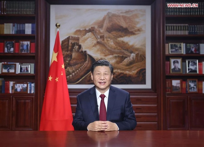 Chú thích ảnh Bài phát biểu năm mới phát sóng trên truyền hình của Chủ tịch Trung Quốc Tập Cận Bình ngày 31/12. Ảnh: THX