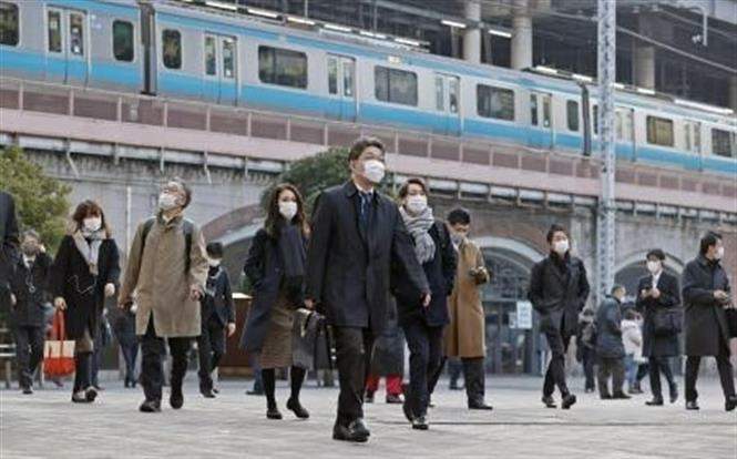 Người dân đeo khẩu trang phòng lây nhiễm COVID-19 tại Tokyo, Nhật Bản, ngày 7/1/2021. Ảnh: Kyodo/ TTXVN