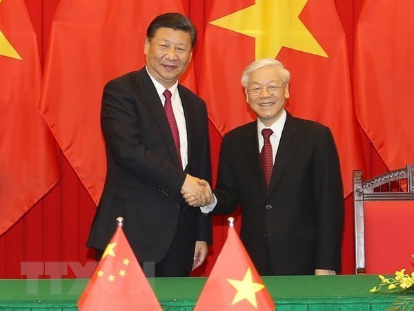 Tổng Bí thư, Chủ tịch nước Nguyễn Phú Trọng (phải) và Tổng Bí thư, Chủ tịch nước Trung Quốc Tập Cận Bình. (Ảnh: Trí Dũng/TTXVN)