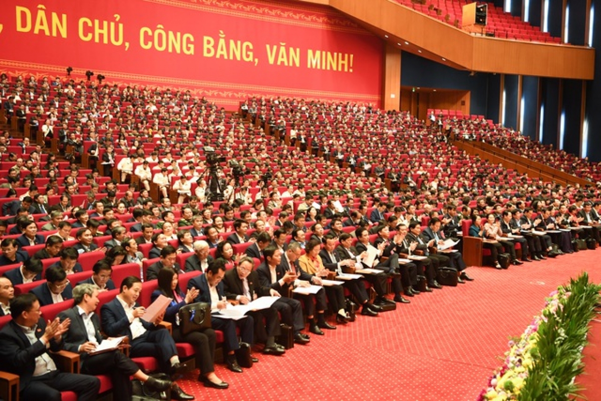 Các đại biểu nghe công bố danh sách trúng cử Ban Chấp hành Trung ương khóa XIII.