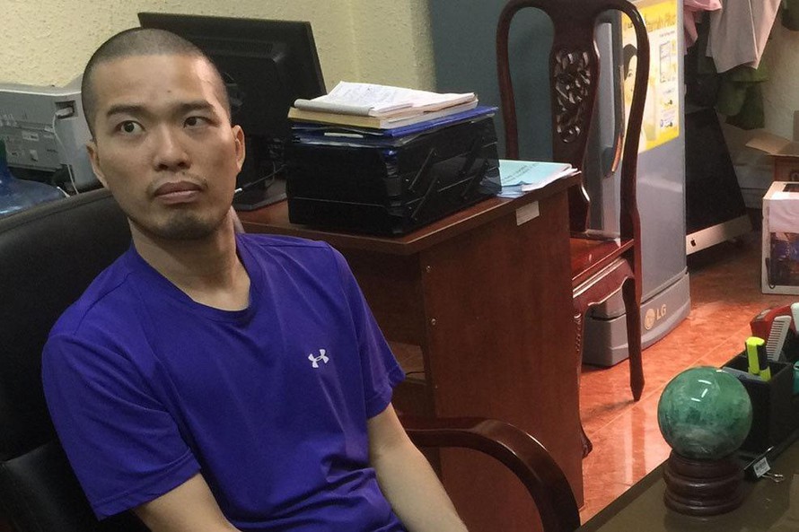 Nguyễn Minh Đạt thời điểm bị bắt giữ. Ảnh: CA