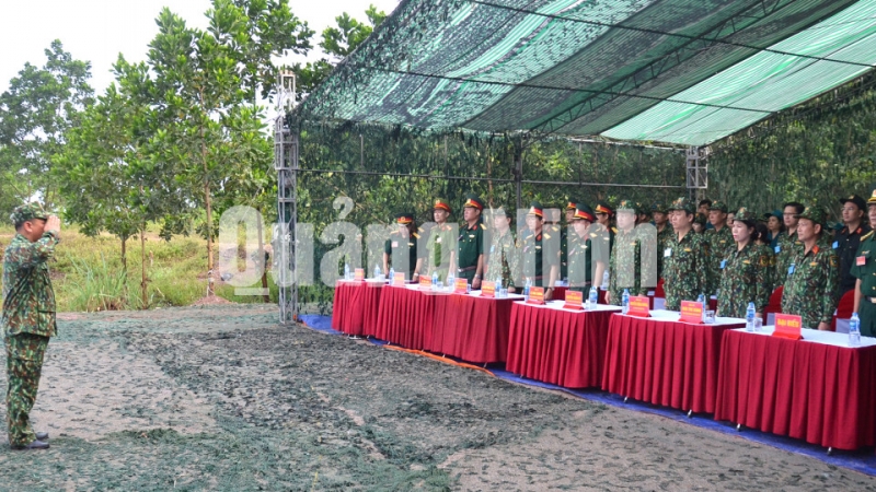 Các đại biểu nghe đơn vị vũ trang trên địa bàn báo cáo kế hoạch thực binh (9-2019). Ảnh: Nguyễn Thanh
