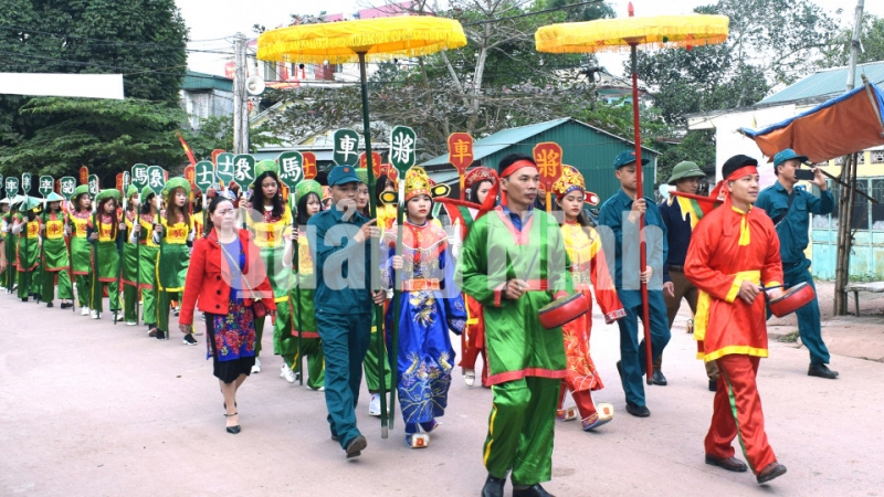 Lễ rước trong hội cờ người truyền thống xã Đài Xuyên, huyện Vân Đồn (2-2019). Ảnh: Thành Công