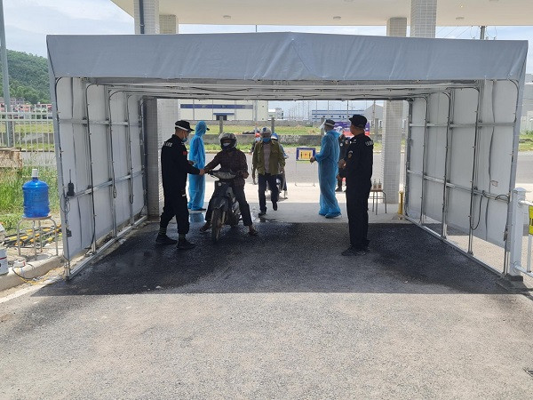 Workers receiving temperature checks before entering production facilities. Photo: VGP