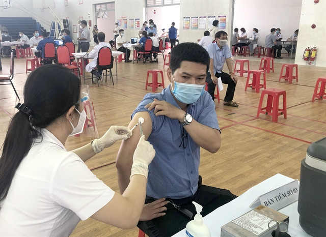 People in the central Bình Định Province get their vaccination yesterday. Vaccine is considered the fastest way for the economy to recover from the COVID-19 pandemic. 