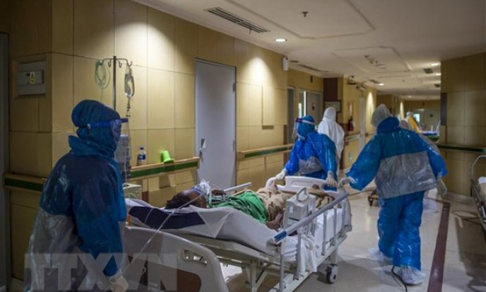 COVID-19: Malaysia và Indonesia lập 'đỉnh' về số ca mắc mới và tử vong