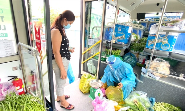 Buses sell vegetables around HCM City