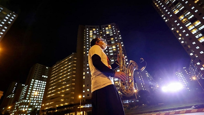 Saxophonist Tran Manh Tuan performs the song 
