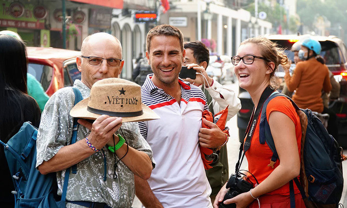 A group of French tourists visit the capital of Hanoi in February, 2019. 