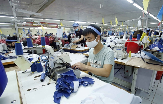 Workers produce clothing products at Tiên Hưng Garment Company in the northern province of Hưng Yên. 