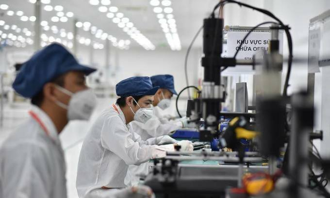 Employees work at a smartphone factory in Hai Phong City, northern Vietnam.