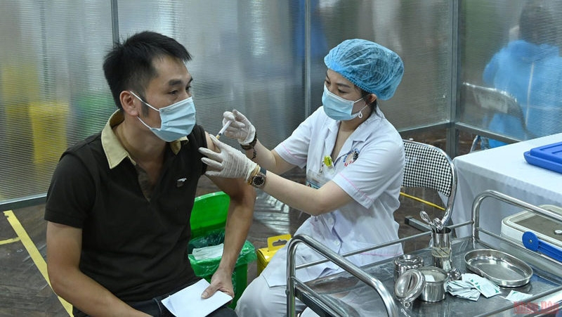 A man is vaccinated against COVID-19.