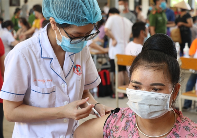 A COVID-19 vaccine being administered in Quảng Ninh Province.