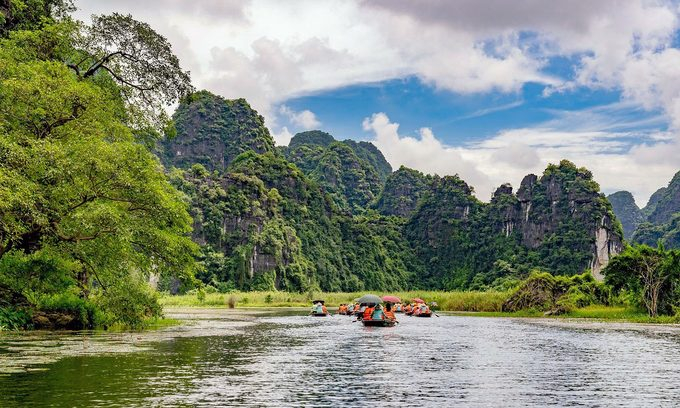 Tourists join boat tours in Trang An Natural Landscape Complex in Ninh Binh Province, 2020. 