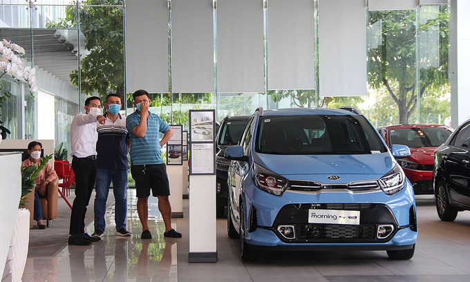 November auto sales rise to year high as government halves registration fee