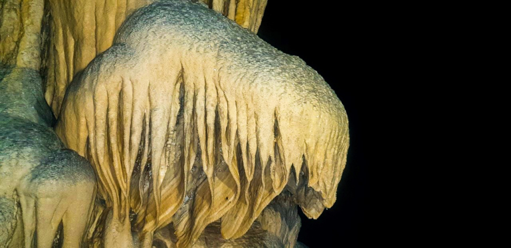 The stalactite system in the cave is still in the process of forming.