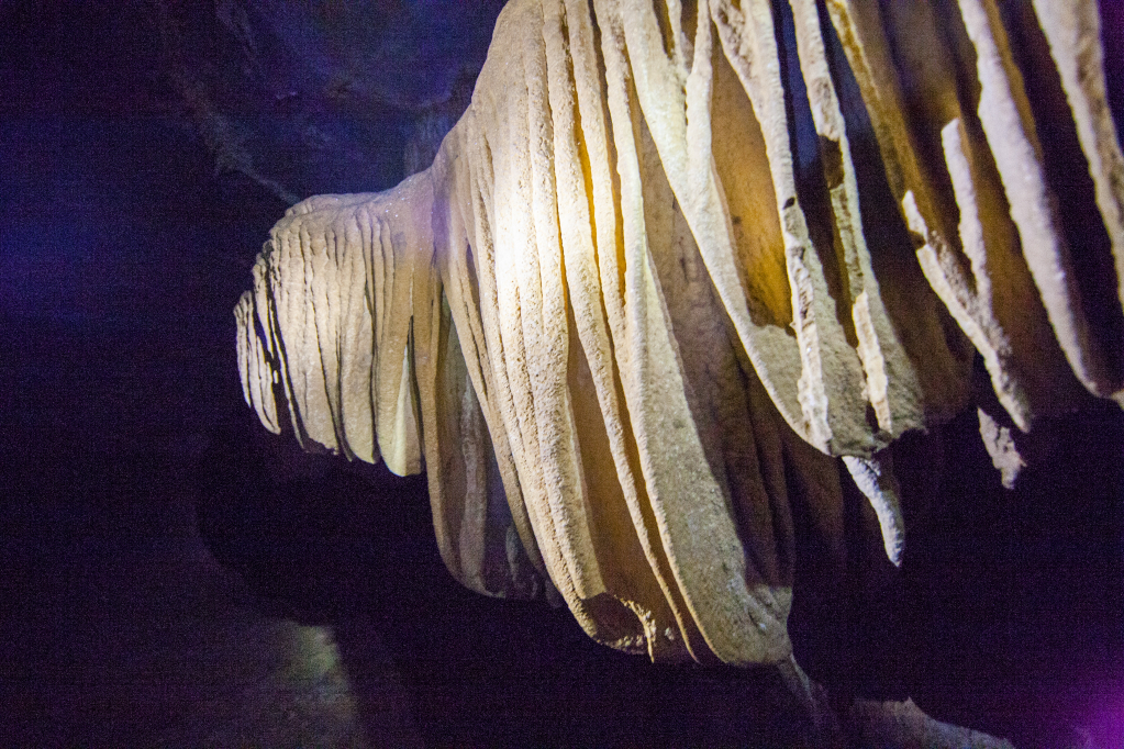 Stone curtains on the cave's walls.