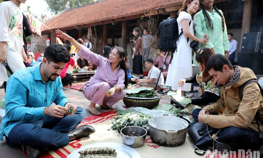 International friends enjoy the Vietnamese Lunar New Year festival at an ancient village