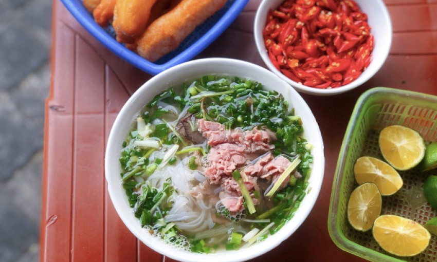 Eaters enjoy train sounds at Hanoi pho joint
