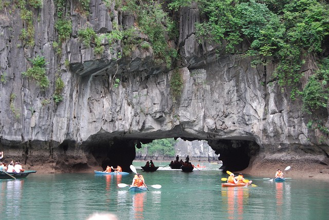 Tourists visit the world heritage site Ha Long Bay.