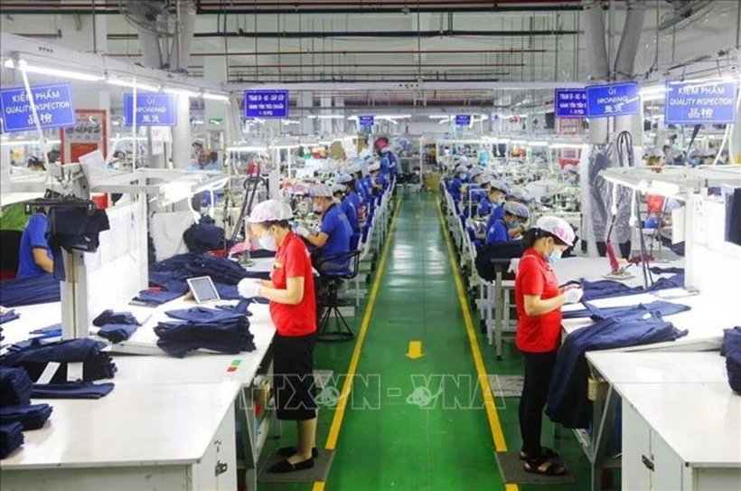 At a garment factory (Source: VNA)